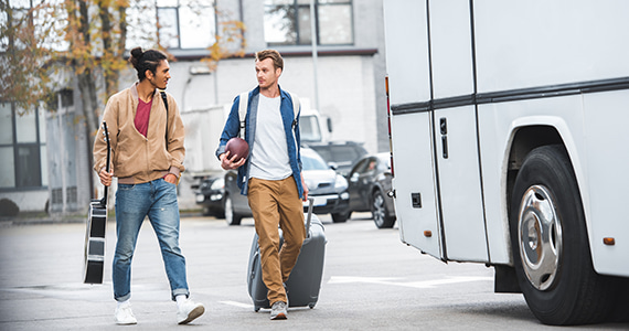 passengers happily boarding a long island charter bus